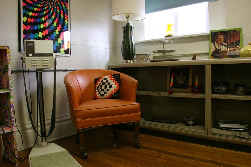 Sit a spell in this 60s corner or lose some inches on that exercise equipment, left.