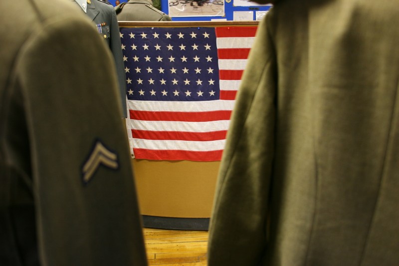 Between two military uniforms, I shot this view of a 48-star American flag.