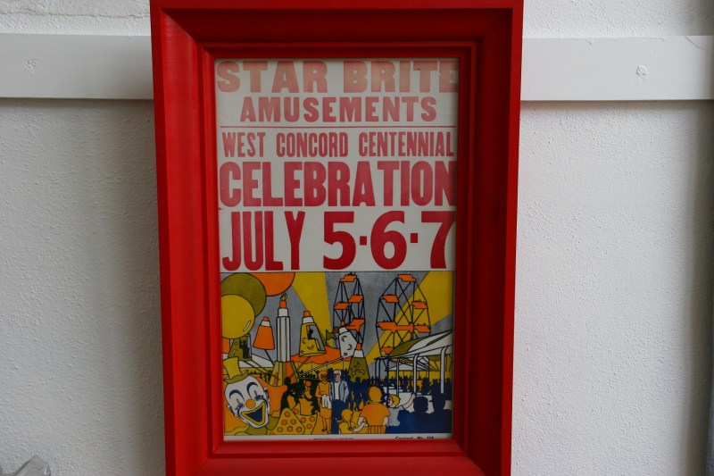 A West Concord Centennial poster hangs in a hallway outside the research room.