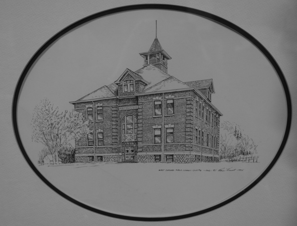 A drawing of the 1902 school hangs in a hallway.