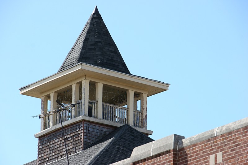 The roof of the aged school is topped with this unique architectural structure.