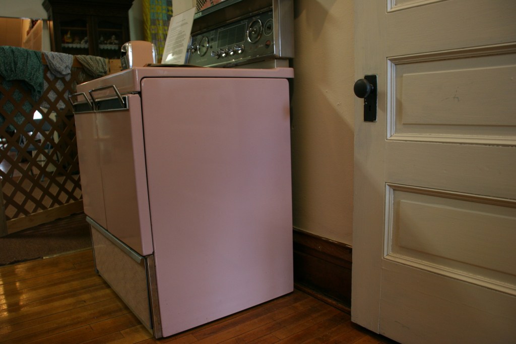 This pink Frigidaire electric stove was purchased by Arthur and Lorraine Spreiter in about 1959 from Pirkl and Hall Appliance along Main Street in West Concord. The stove features double oven doors rather than a drop-down door. The Spreiters also purchased an upright pink refrigerator/freezer.