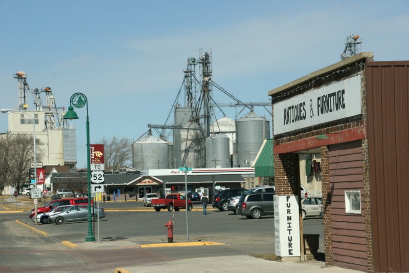 On the left, a street sign directs motorists to U.S. Highway 52. On the right, the antique store that was closed the afternoon of my visit to Pine Island.