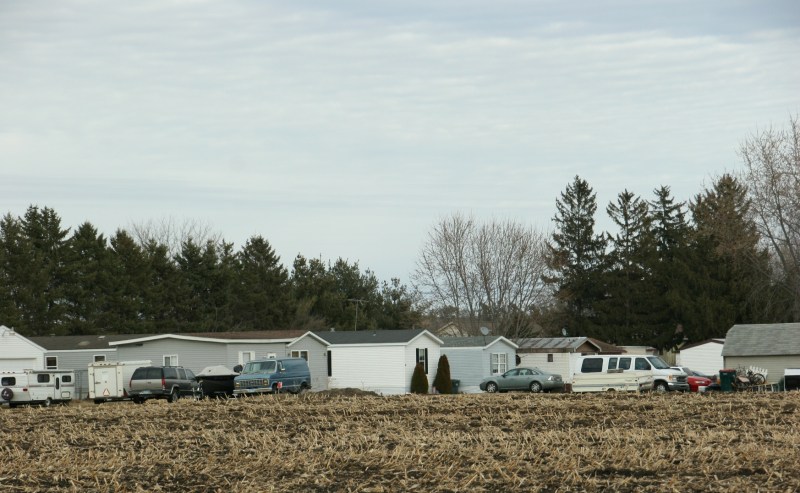 Driving out of town, I shot this image of Pine Island's mobile home court across the cornfield.