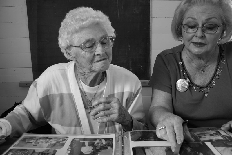 Helen Newman, left, and Cindy Packard work on a Morristown sesquicentennial scrapbook in June 2013.