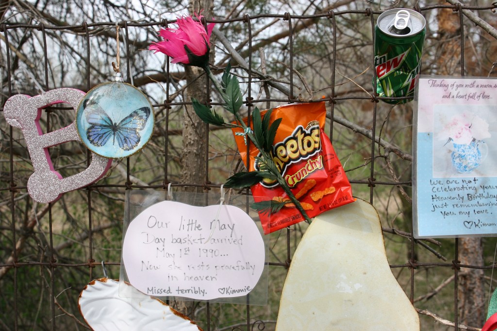 Items attached to a fence reveal more about Brittney.