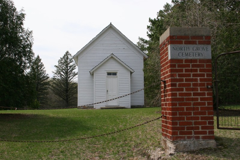 The entrance to North Grove Cemetery, which sits along Minnesota Highway 3 north of Faribault. The building once housed a church.