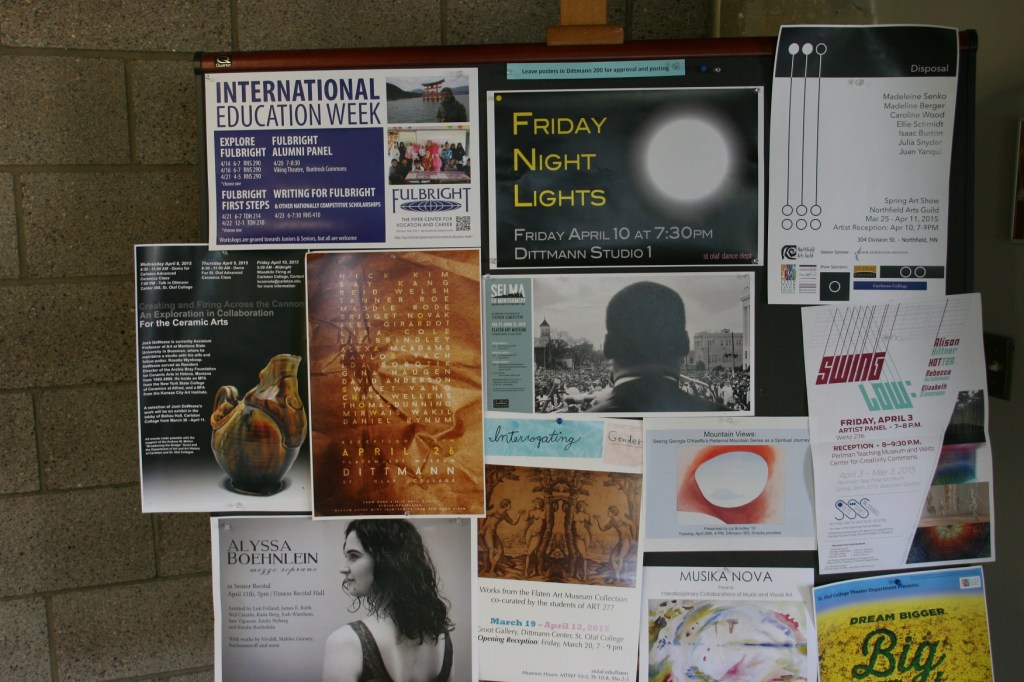 In the center of this display space outside the Flaten Art Museum is a poster for the "Selma to Montgomery" exhibit on the Civil Rights Movement.