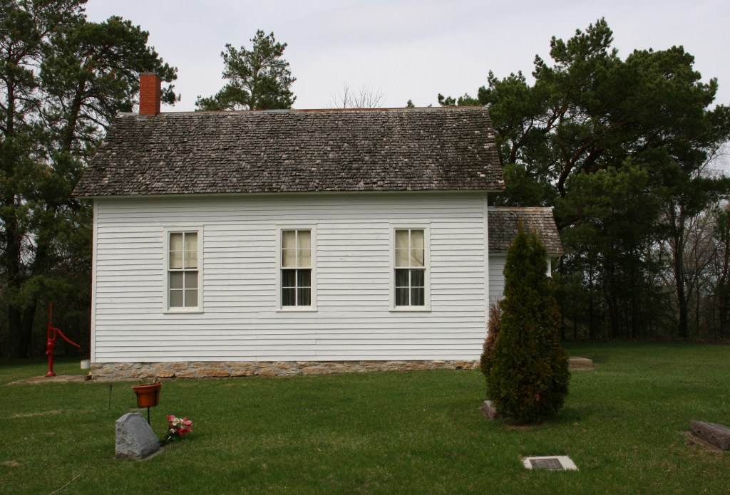 As was common in early Minnesota churches, the cemetery is right next to the church building.