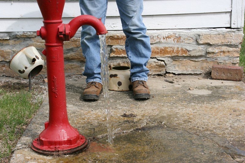Imagine the hands that worked this pump, those who drank the earth's water. The pump is located behind the church.