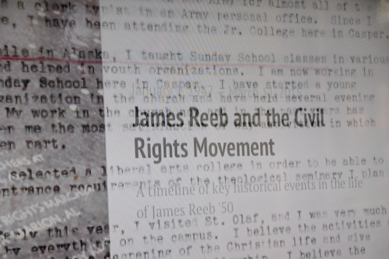 Words play across a screen in a video next to the memorial.