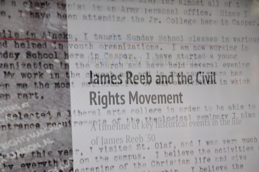 Words play across a screen in a video next to the memorial.