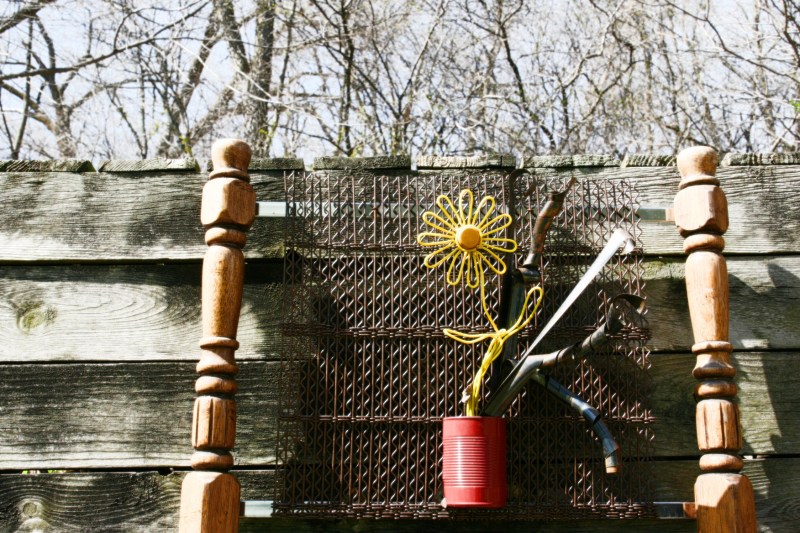 My artist friend Steve Denninger gifted me with this piece of original garden art created from recycled items. It hangs on an old wooden box in my backyard. The box is built from a recycled fence.