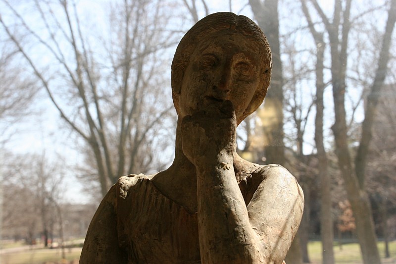 I got down low to photograph the Greek woman sculpture encased in glass.