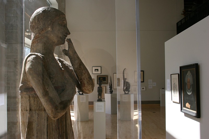 The angle at which I photographed "Archaic Greek Statue of a Woman" makes it appear as if the Italian terra cotta sculpture is studying the art on display.