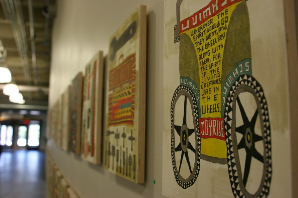 Walking across the hall from one museum space to another, I found Michon Weeks' "Wheel Within Wheel (#1-44) paintings hung along the atrium wall. The acrylic on paper on wood panel is a visual inventory of items in her Northfield garage.