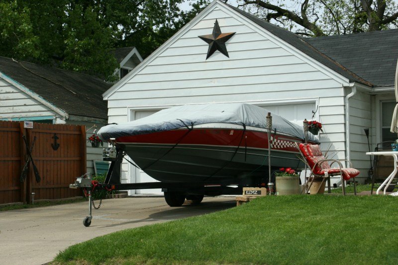 You'll see lots of boats, like this one parked in a residential driveway.