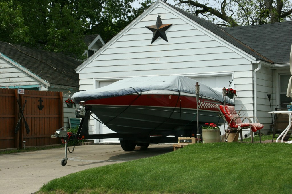 You'll see lots of boats, like this one parked in a residential driveway.
