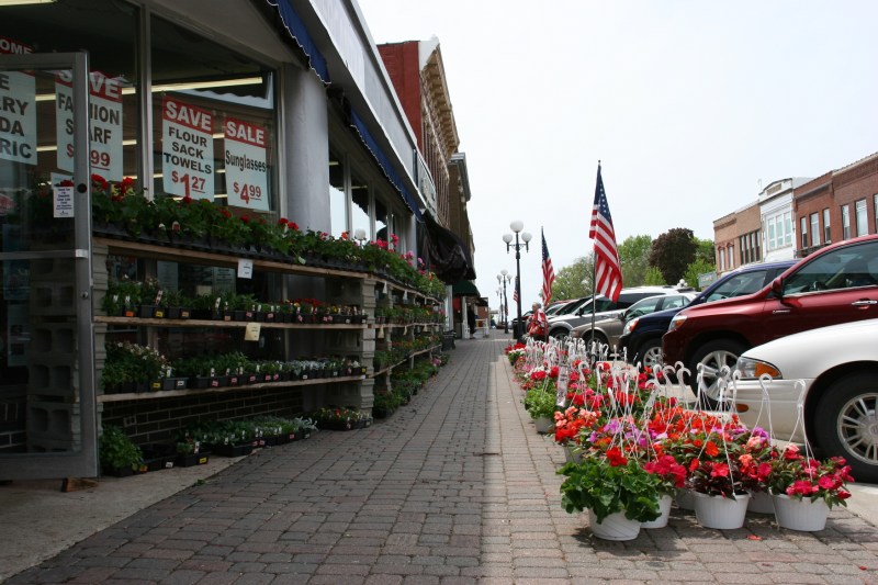 Flowers and plants bordered two three sides of the corner Larson's Mercantile, a popular stop for shoppers.