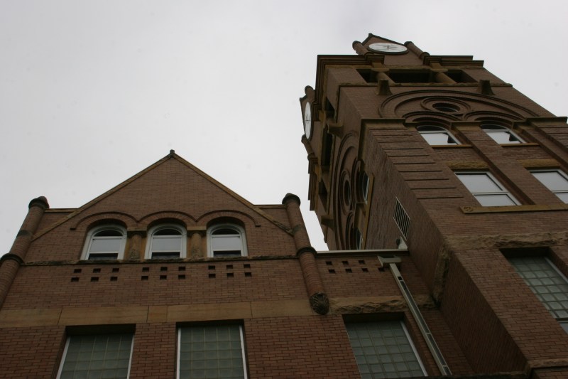 Aiming my camera up at the towering courthouse.