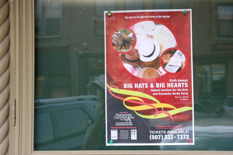 A poster in an exterior window promotes the Derby event.