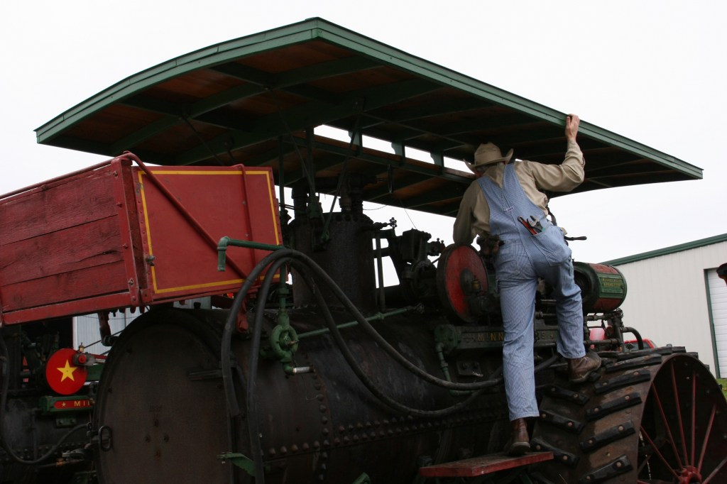 Checking out a steam engine tractor during Steam School.