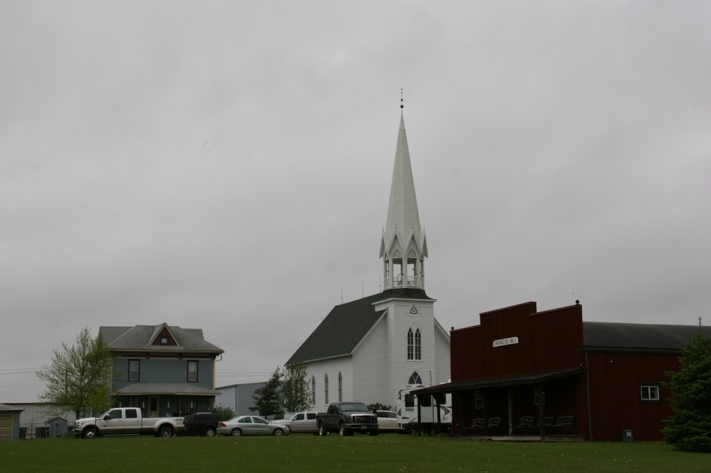 A sampling of smaller steam engine tractors were lined up across the road from the park's historic church.