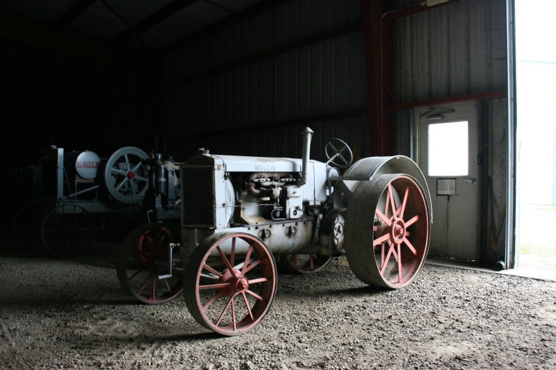 A Wallis tractor was among the many tractors stored in a massive building.