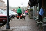 Iowa, man with dog in clear lake