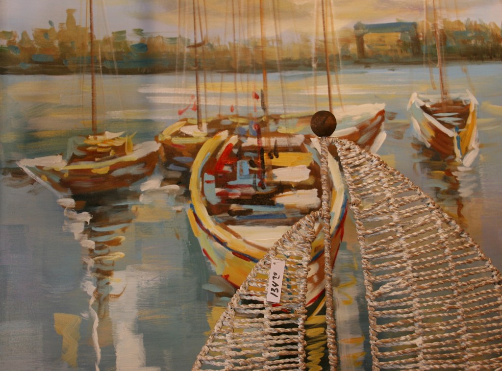 Many of the downtown shops sell water/lake/nautical themed art like this photographed at The Red Geranium.
