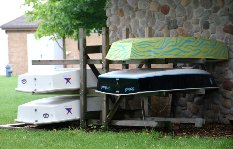 Boats stacked behind the Clear Lake Yacht Club next to the public access. 