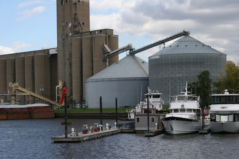 Recreation (boats) and commerce (grain elevator and bins) mingle here.