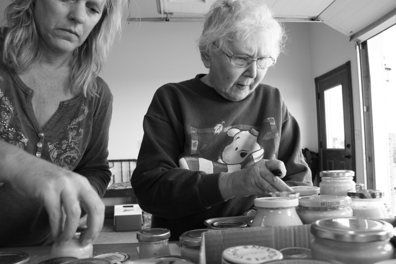 My mom counts jars of horseradish with my sister-in-law after a family gathering to make horseradish.