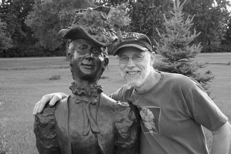 Randy obliges my request to pose with a sculpture in a Prairie du Chien, Wisconsin, park we toured while vacationing.