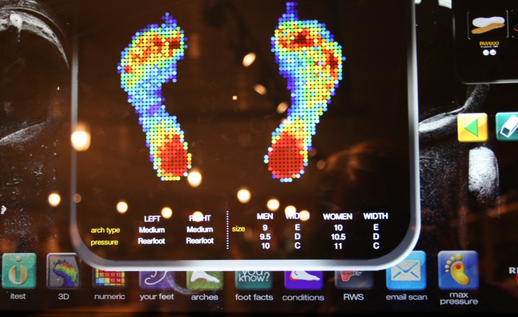 Randy stepped onto a machine which determined pressure points on this feet and projected the results onto a screen.