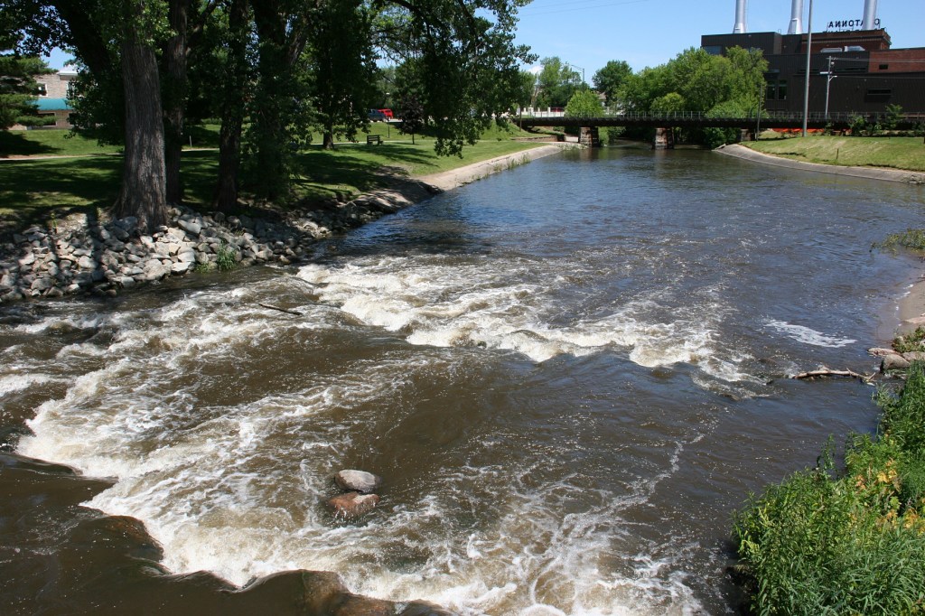 A view of the Straight River from the pedestrian bridge in Morehouse Park.