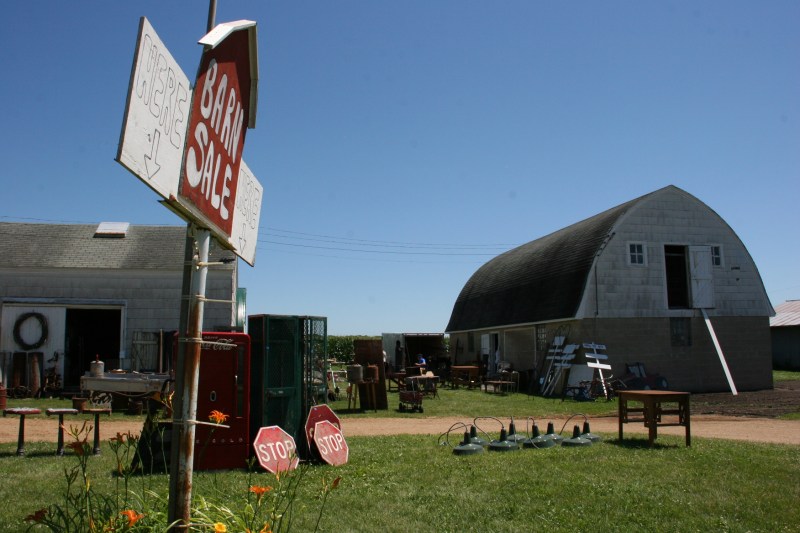 Park along the edge of the circle drive or on Frontage Road and then amble up to the Barn Sale.