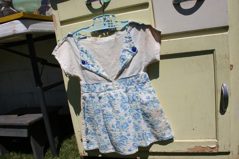 A vintage clothespin bag offered by a vendor.