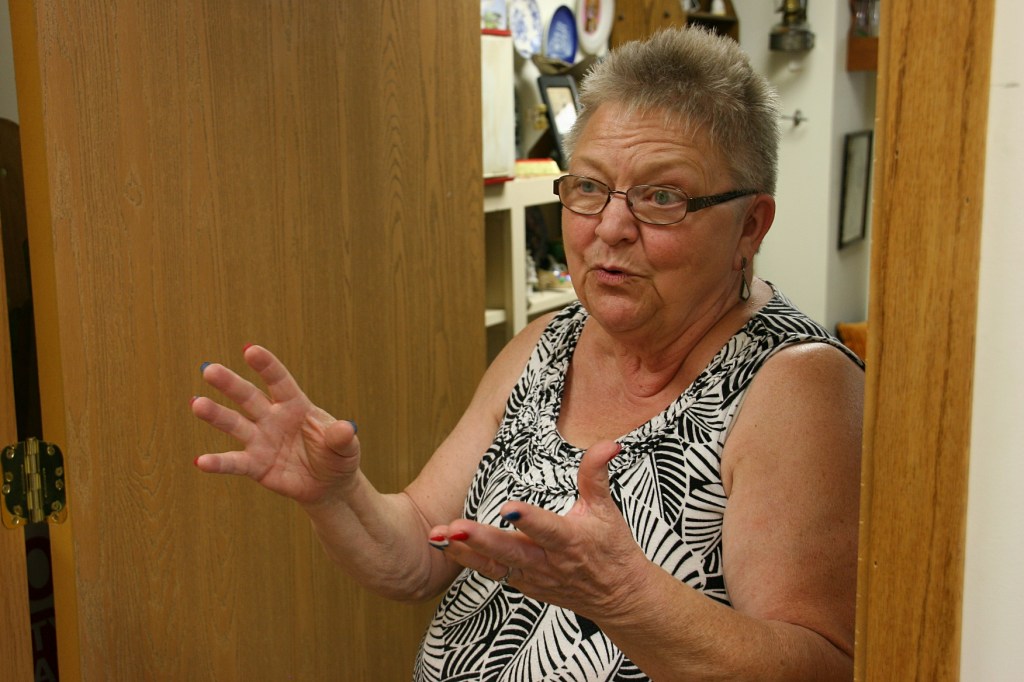 Audre Johnson loves to chat it up with customers. She talks with her hands while she talks. And lovely hands they are, too, with those patriotic red, white and blue polished fingernails.