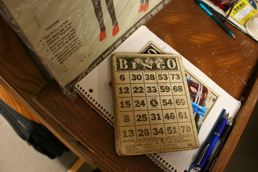 Underneath the top bingo card is the bingo card photo frame Audre crafted. And below that is a notebook where customers can jot down items they are searching for.