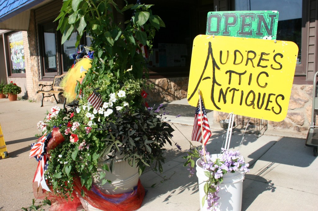 An exterior sign marks Audre's shop.
