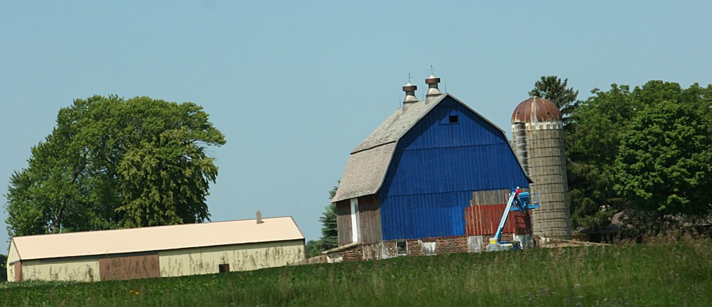 You can see how the barn looked before it was painted blue.