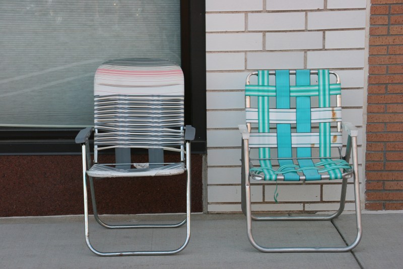 Car cruise participants typically bring lawn chairs and sit near their vehicles.