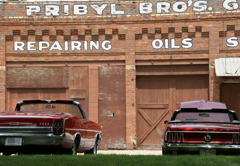 I absolutely love this aged building along Elysian's Main Street. These two cars were in the car show.