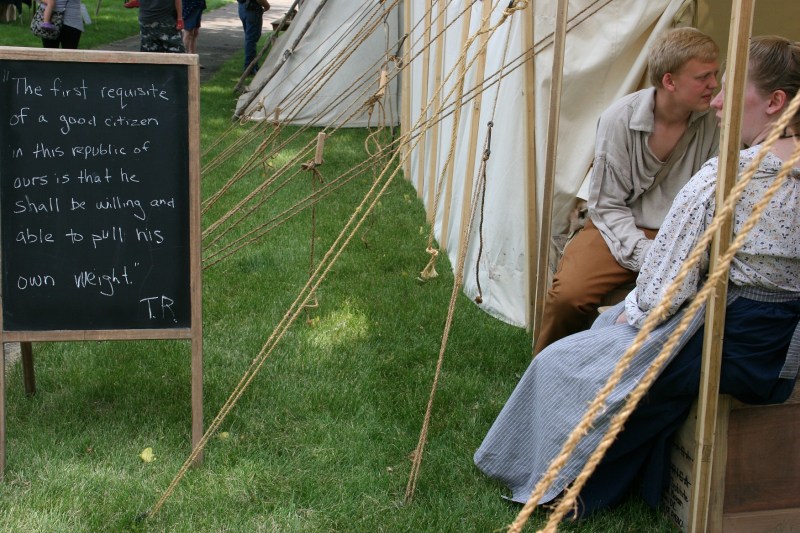 A fitting July Fourth weekend sign posted outside a Trail of History tent.