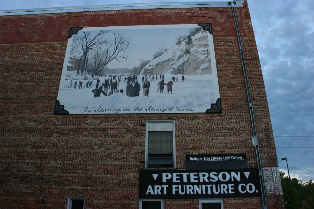 When you're sipping on the patio, don't miss this mural of iceskaters on the Straight River.