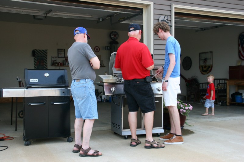 Teaching the next generation how to grill brats.