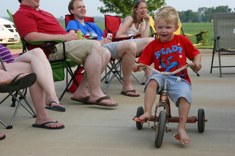 My great nephew barrels his way between the lawnchairs on his way to an imaginary fire.
