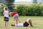 Family, kids playing on&nbsp;grass