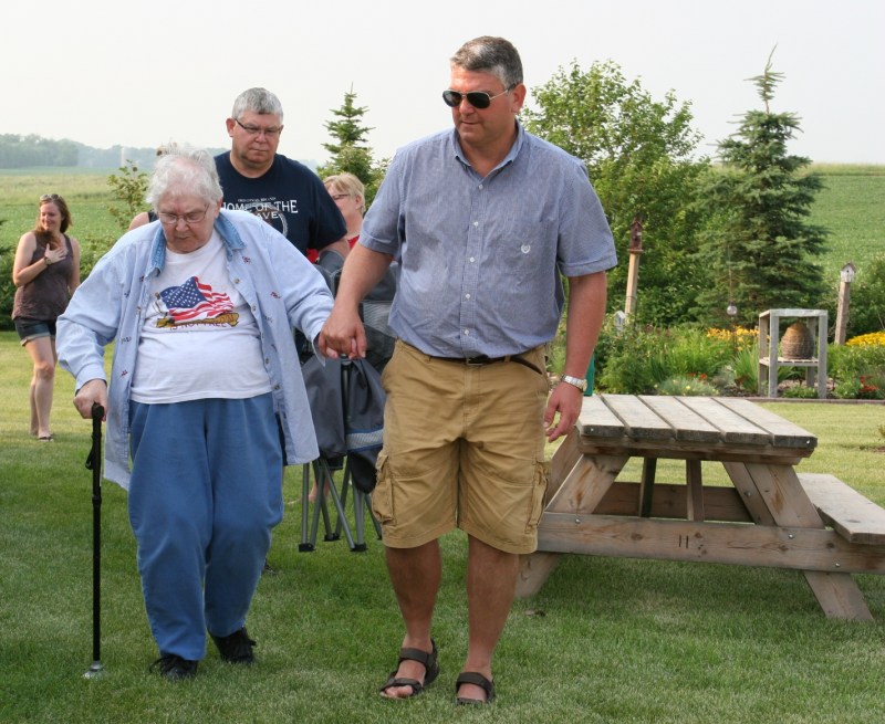 Eighty years spanned those in attendance with my 83-year-old Mom as the eldest. Here she is with my youngest brother, right, and my oldest brother behind.